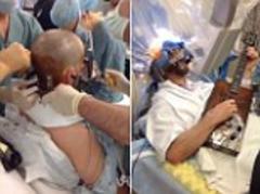 'I played guitar during brain surgery': Incredible video shows patient strumming away as doctors live-streamed his operation