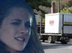 Kristen Stewart cuts a sad figure after watching moving trucks take away the last of Robert Pattinson's belongings from her home